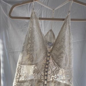 White lace, floor length dress.